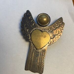 Sterling Silver Angel pendant with Heart Design. No chain included. Pin and pend